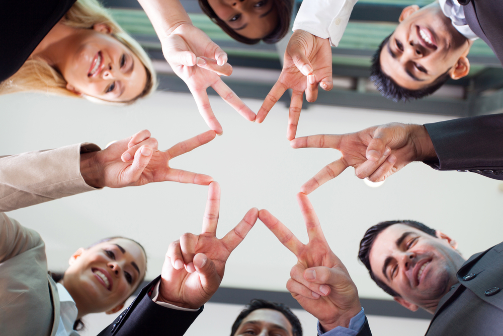 business people hands forming a star shape